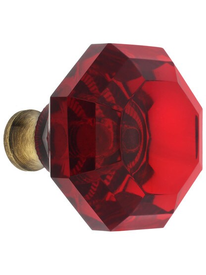 Red Octagonal Crystal Knob with Solid Brass Base in Antique Brass.